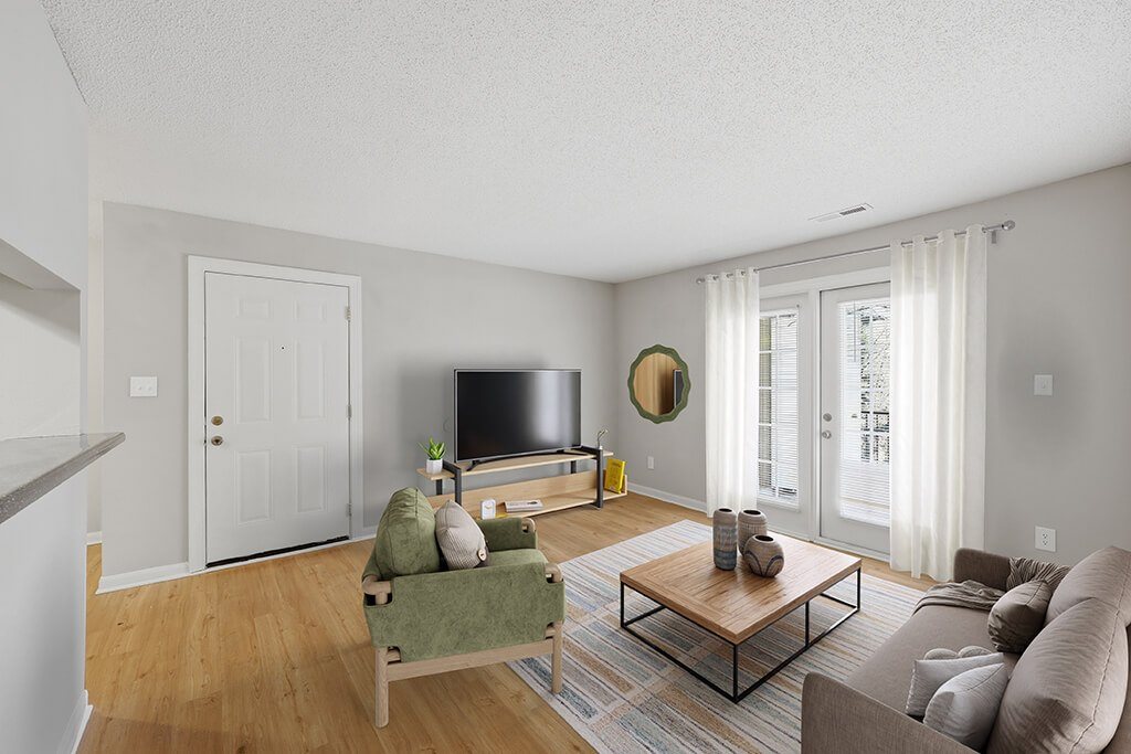 Living room with natural light at Greens of Pine Glen in Durham NC